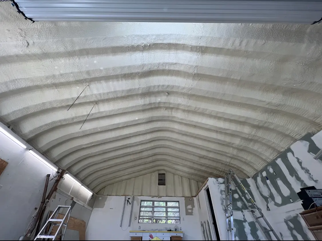 Spray polyurethane foam applied to the underside of a metal roof deck in Harrisville